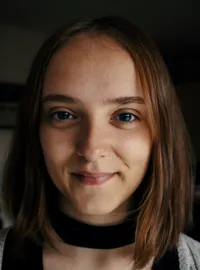 A woman finds a moment of peace on a city rooftop, reflecting the emotional support users find in AI.