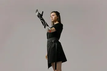 A futuristic woman with a bionic arm, representing the intersection of humanity and artificial intelligence.