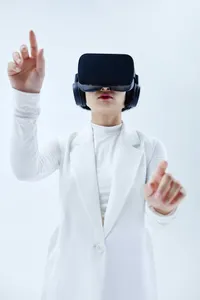 A woman using a VR headset, immersed in a digital world.